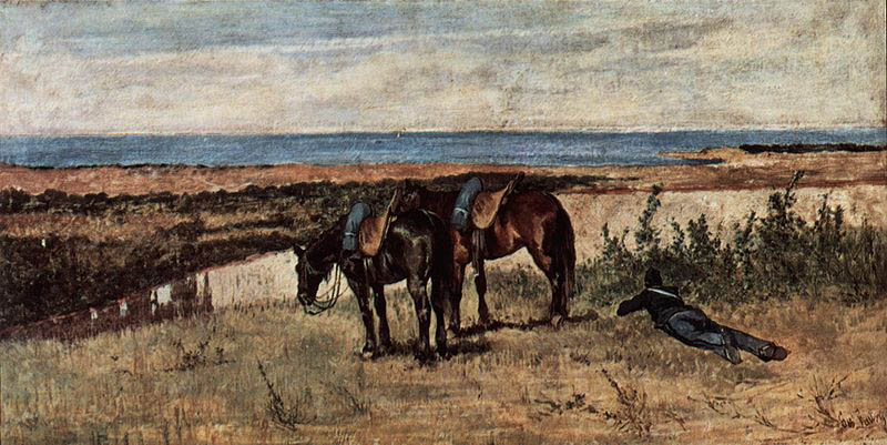 Soldat mit zwei Pferden am Ufer des Meeres